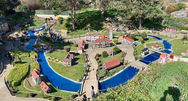 A Wild Tale of Foxes Transforming an Enchanting Model Village into Their Playground Adventure